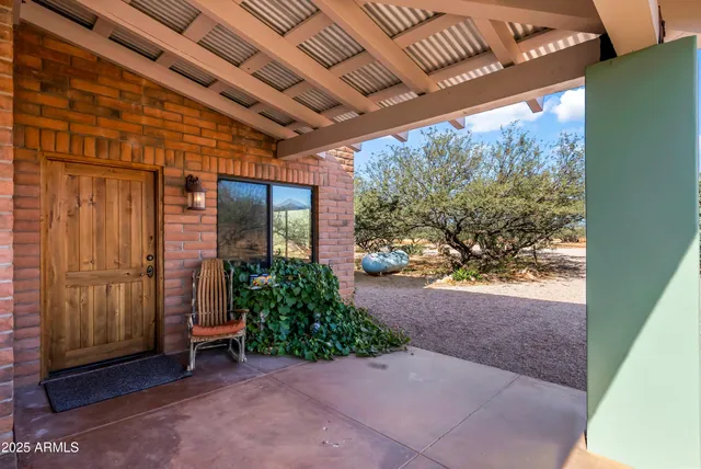 a view of a chairs and table in the patio