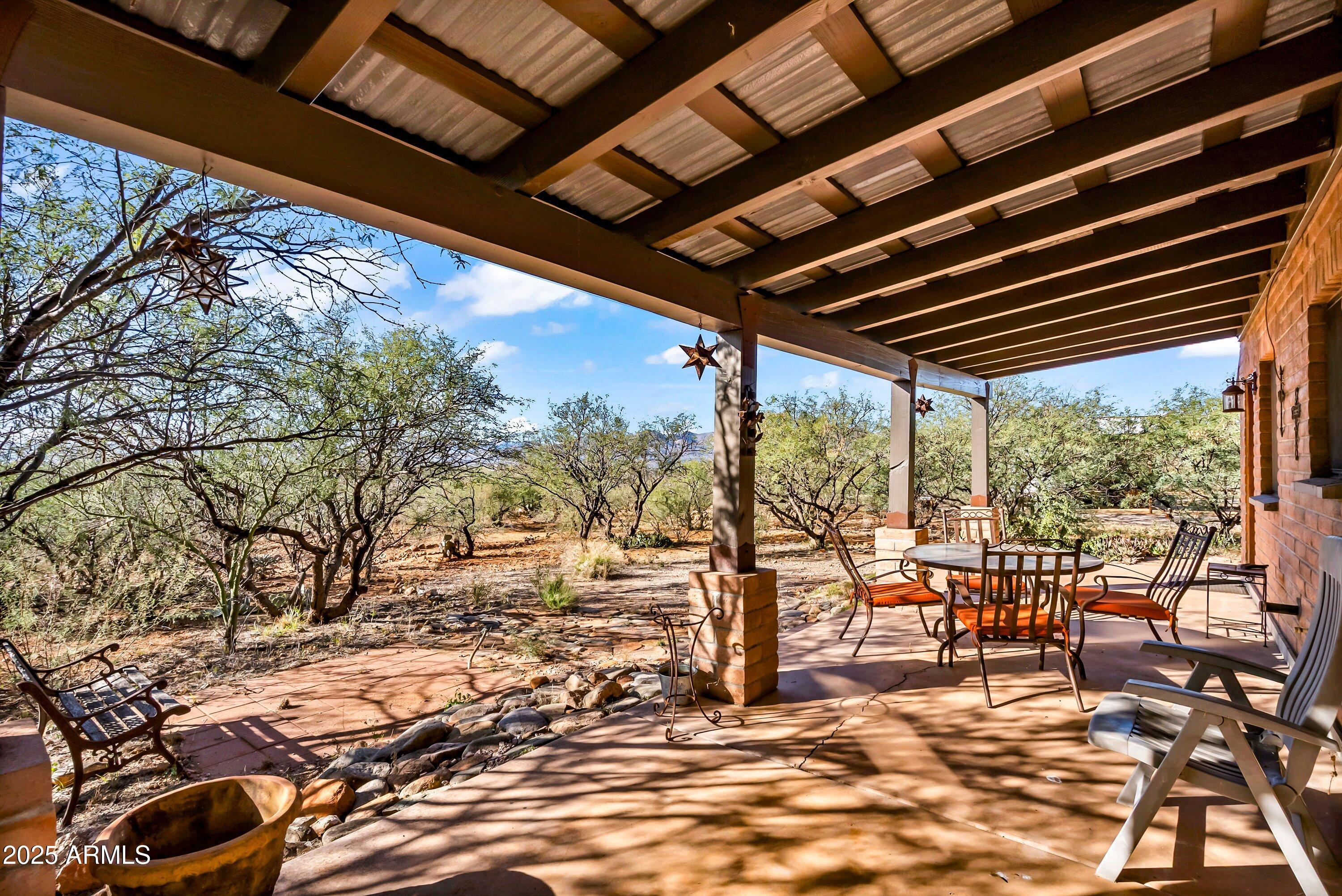 78 Camino Murphy Rio Rico, AZ 85648 - Photo 39 of 51 a view of a chairs and table in the patio