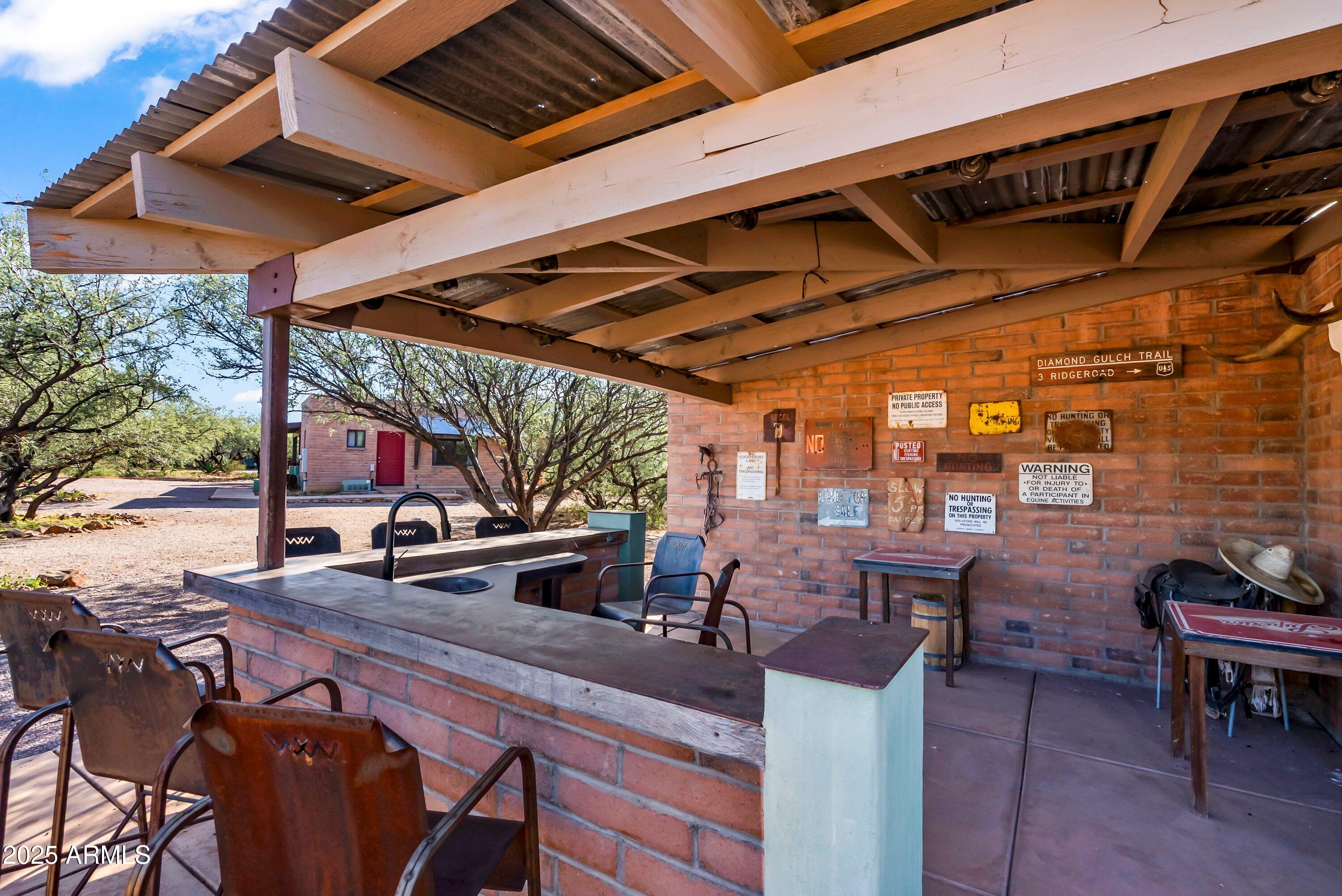 78 Camino Murphy Rio Rico, AZ 85648 - Photo 49 of 51 a view of a patio with table and chairs and potted plants
