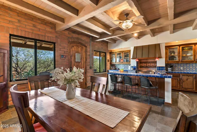a view of a dining room with furniture window and outside view