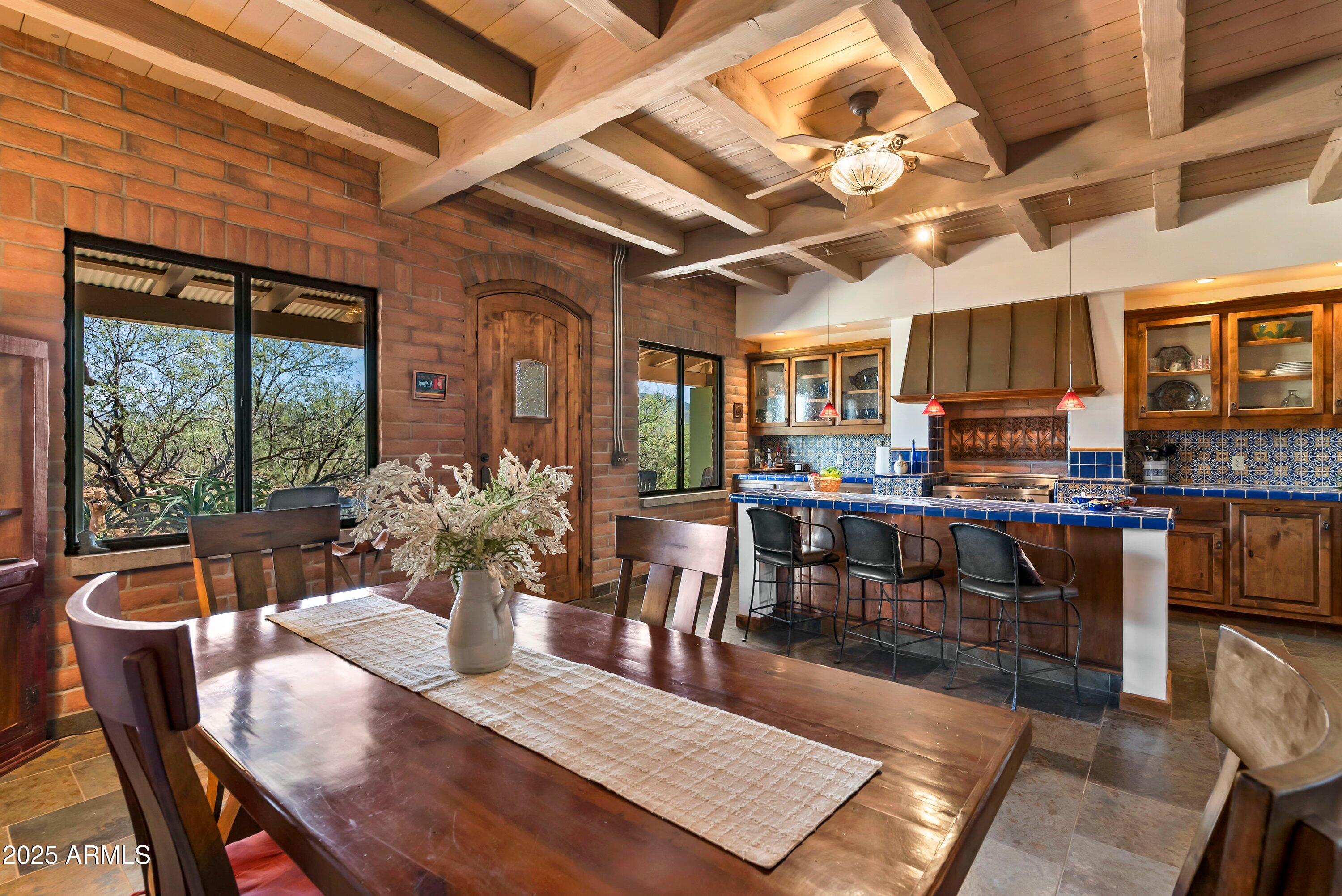 78 Camino Murphy Rio Rico, AZ 85648 - Photo 6 of 51 a view of a dining room with furniture window and outside view