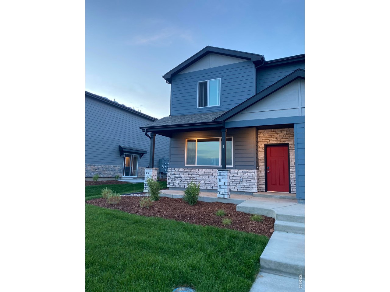 6939 4th St Road, Unit 1 Greeley, CO 80634 - Photo 4 of 30 a view of a house with a yard and sitting area