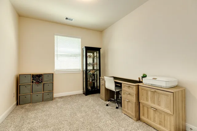 a view of a livingroom with washer and dryer