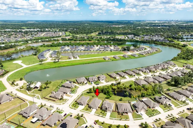an aerial view of a residential building with outdoor space