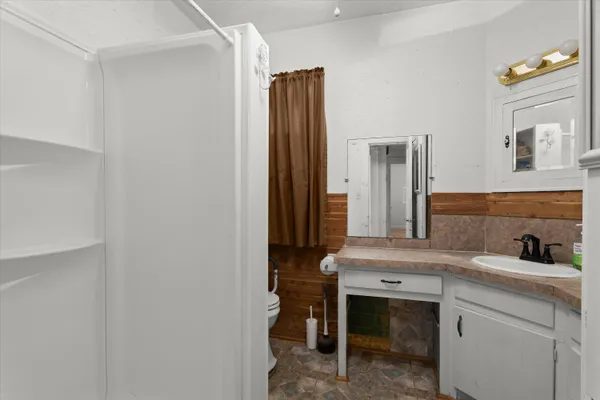 a bathroom with a sink and a mirror