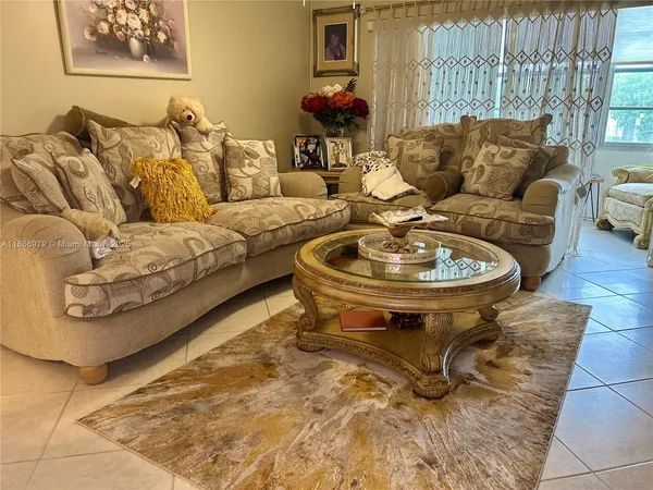 a living room with furniture and a table