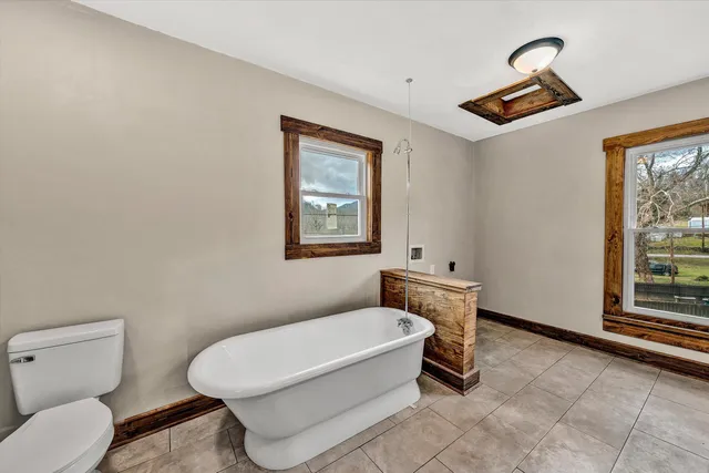 a white toilet sitting next to a bathroom sink