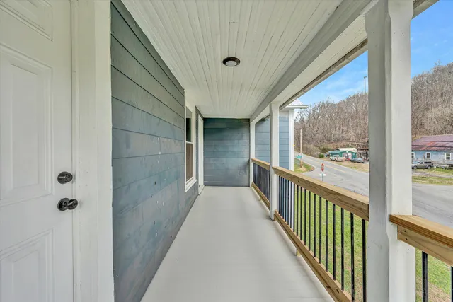 a view of a balcony with wooden floor