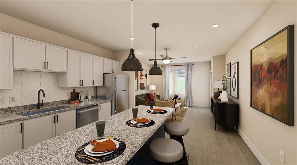 1450 Peachtree Industrial Boulevard, Unit 5109C Sugar Hill, GA 30518 - Photo 3 of 30 a kitchen with stainless steel appliances granite countertop a sink a stove and refrigerator