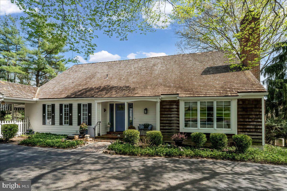 Charming home with lush greenery.