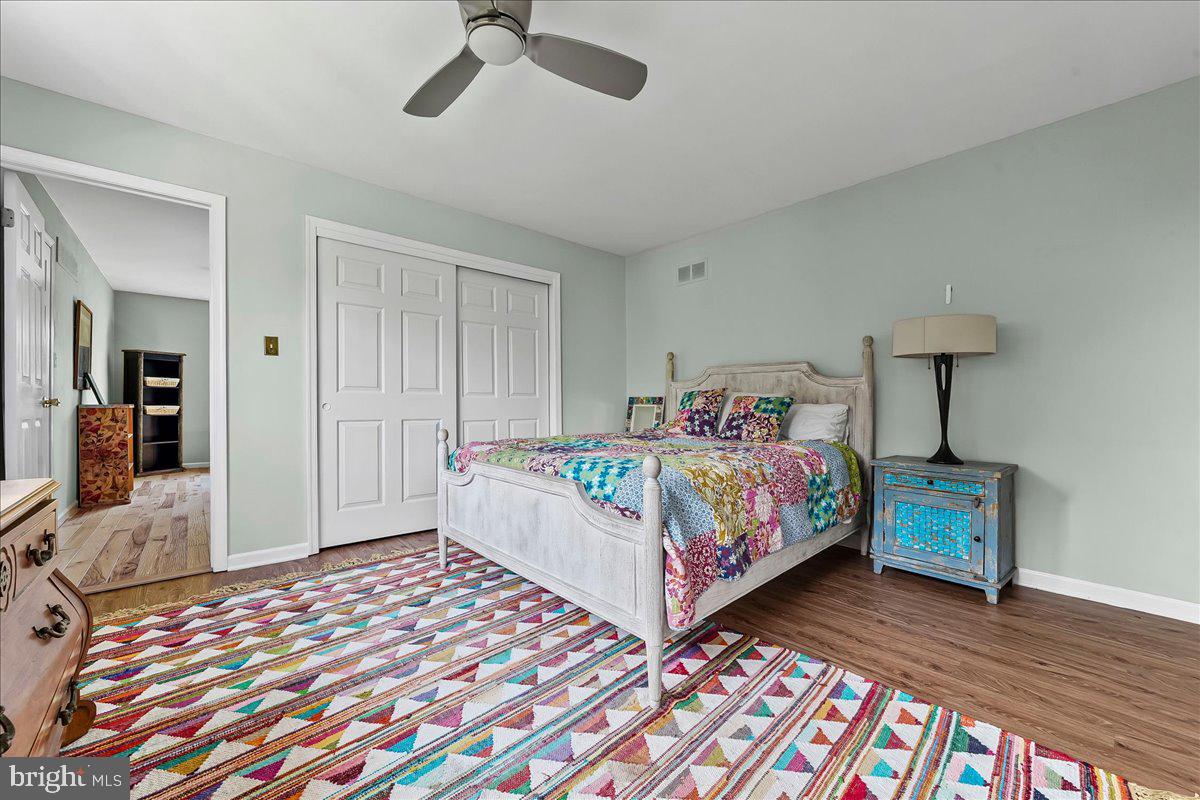 623 South Waterloo Road Devon, PA 19333 - Photo 24 of 31 a bedroom with a bed and wooden floor