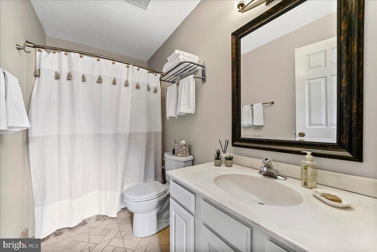 623 South Waterloo Road Devon, PA 19333 - Photo 26 of 31 a bathroom with a sink toilet double vanity and shower