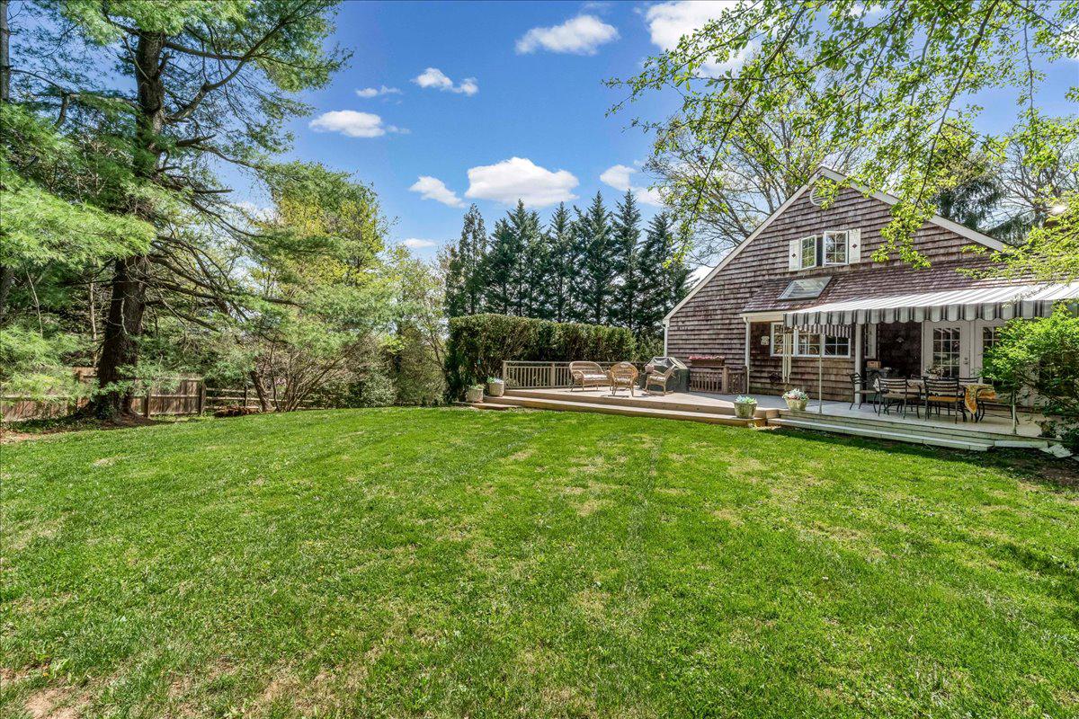 623 South Waterloo Road Devon, PA 19333 - Photo 28 of 31 a view of a house with a big yard potted plants and large tree
