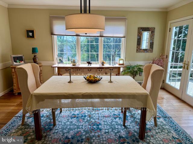 623 South Waterloo Road Devon, PA 19333 - Photo 7 of 31 a living room with a table chairs and a large window