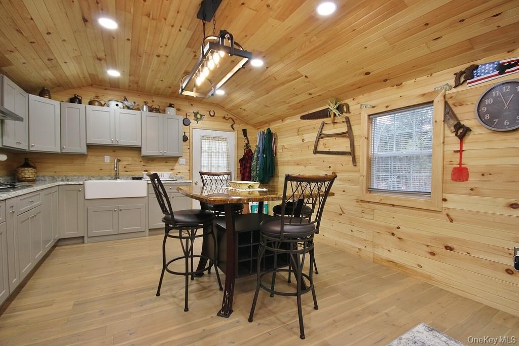 703 Dahlia Road Livingston Manor, NY 12758 - Photo 2 of 44 a view of a dining room with furniture and wooden floor