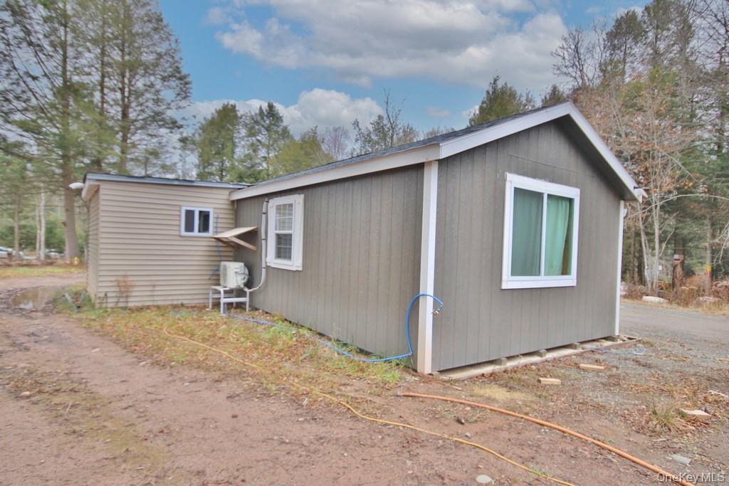 703 Dahlia Road Livingston Manor, NY 12758 - Photo 27 of 44 a house with a outdoor space