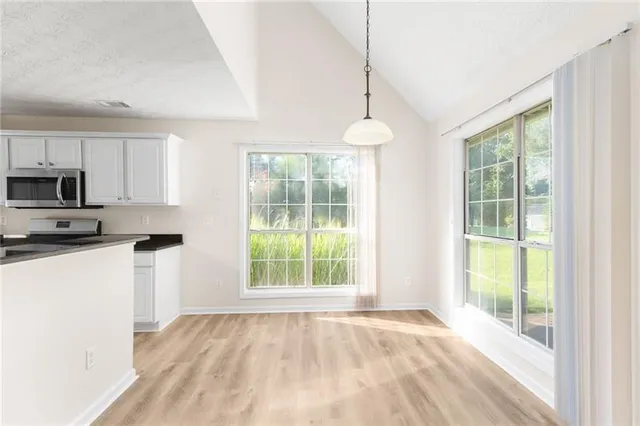 a kitchen with a window a sink and a counter top space