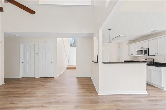 a view of kitchen with wooden floor