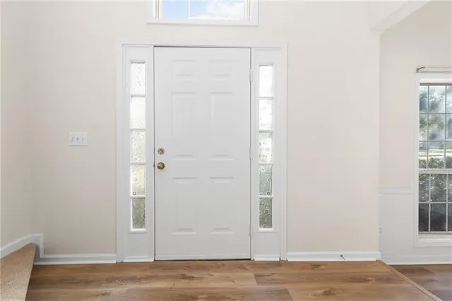 a view of entryway with wooden floor