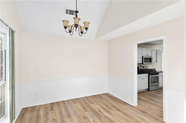 a view of a kitchen from the hallway