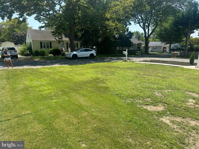 a balcony with table and chairs
