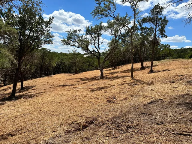 a view of snow on the side of a road