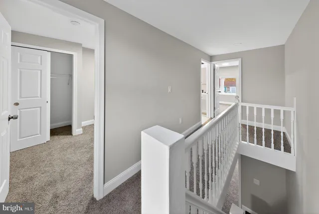 a view of a hallway with windows