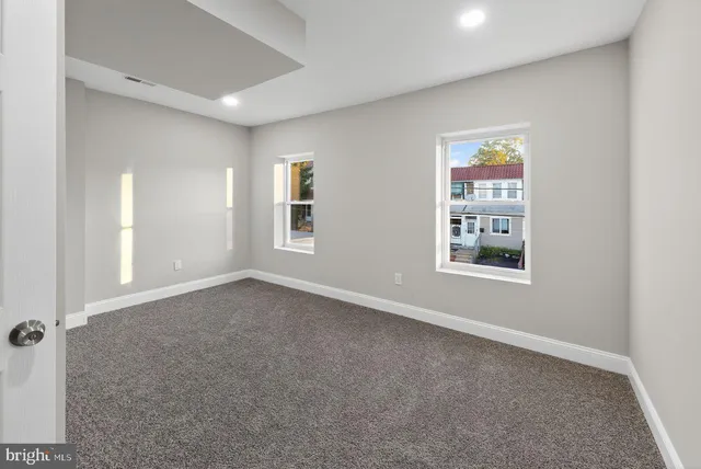 an empty room with windows