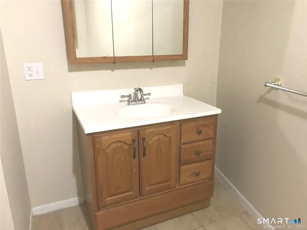 5 Nabby Road, Unit A51 Danbury, CT 06811 - Photo 9 of 13 a bathroom with a sink and a mirror