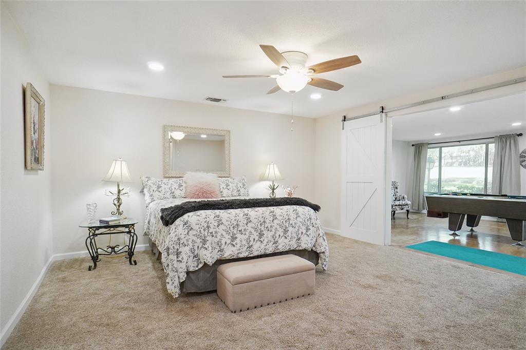 308 Half Moon Way Runaway Bay, TX 76426 - Photo 18 of 40 a bedroom with a bed and window