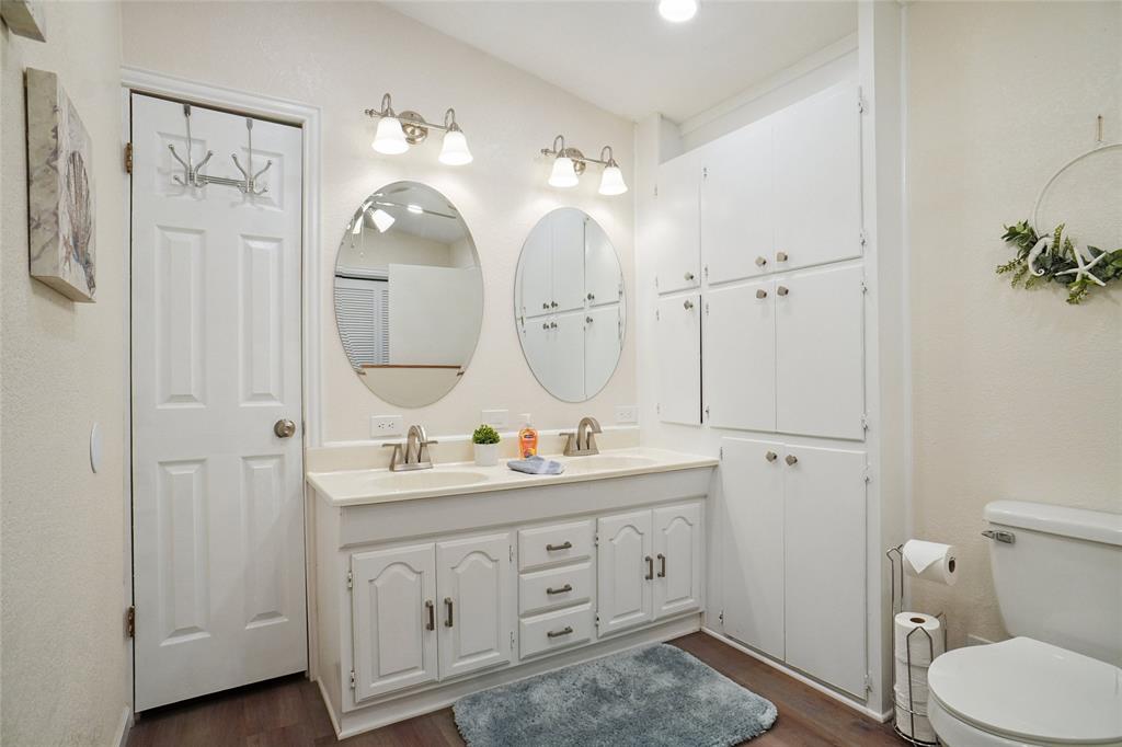 308 Half Moon Way Runaway Bay, TX 76426 - Photo 19 of 40 a bathroom with a double vanity sink mirror and toilet