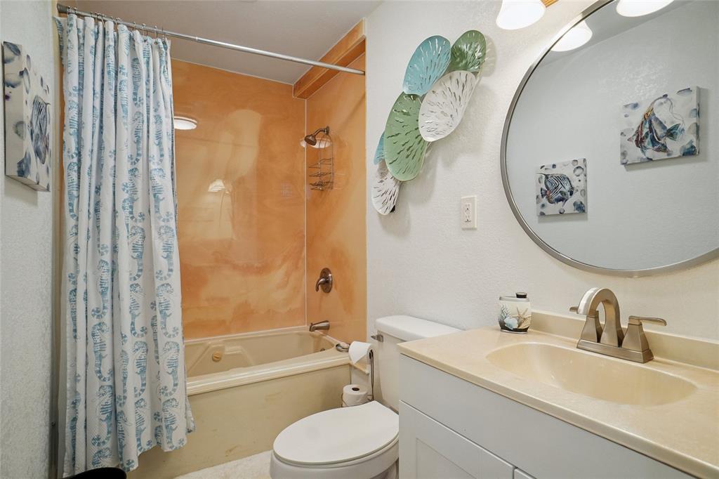 308 Half Moon Way Runaway Bay, TX 76426 - Photo 28 of 40 a bathroom with a sink a toilet and shower