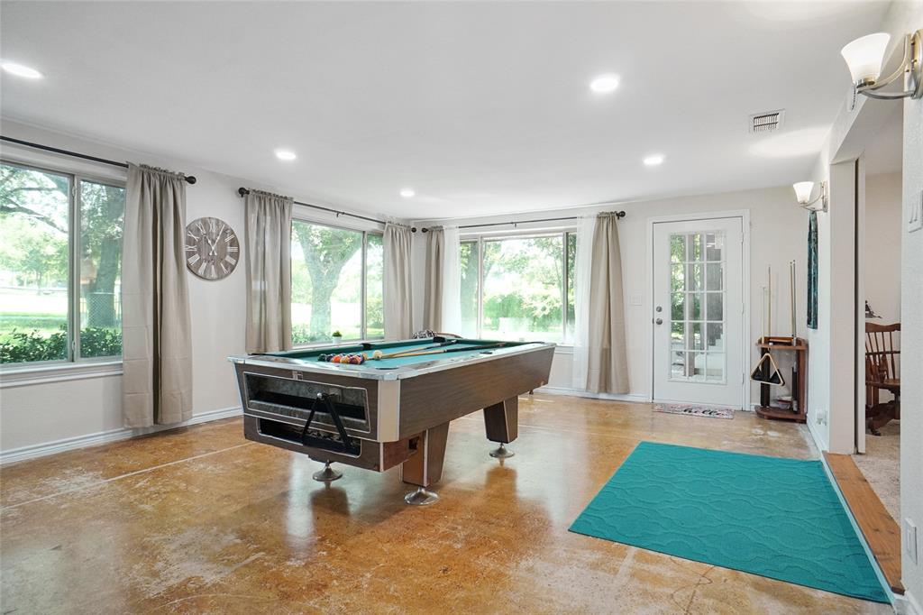 308 Half Moon Way Runaway Bay, TX 76426 - Photo 29 of 40 a room with pool table and windows