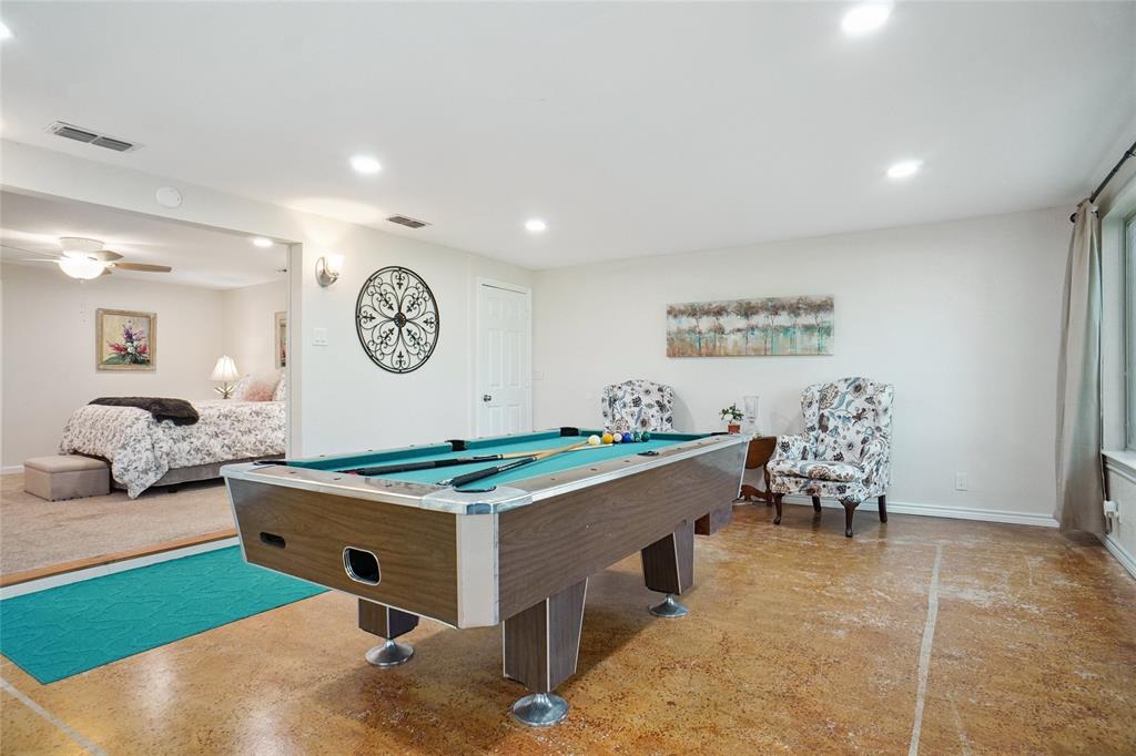 308 Half Moon Way Runaway Bay, TX 76426 - Photo 30 of 40 a room with furniture and clock on wall