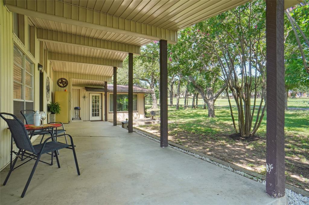 308 Half Moon Way Runaway Bay, TX 76426 - Photo 33 of 40 a view of a house with backyard and porch