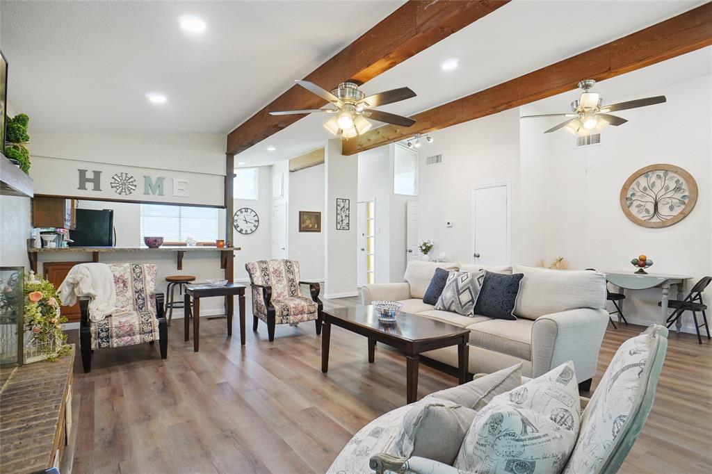 308 Half Moon Way Runaway Bay, TX 76426 - Photo 9 of 40 a living room with furniture kitchen view and a chandelier
