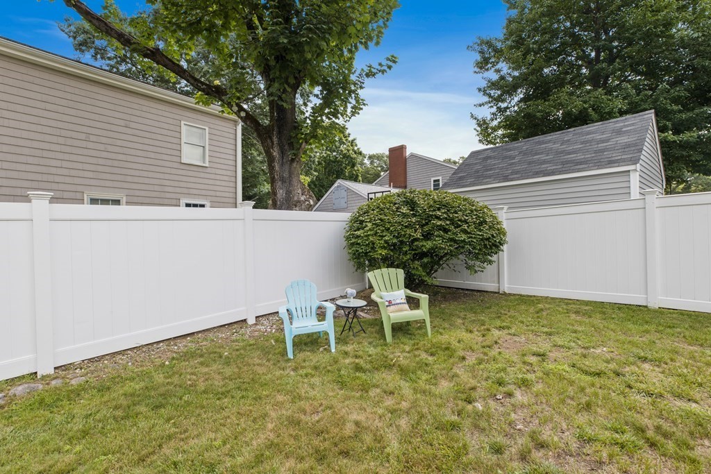 18 Blackman Road Canton, MA 02021 - Photo 27 of 30 a backyard of a house with table and chairs