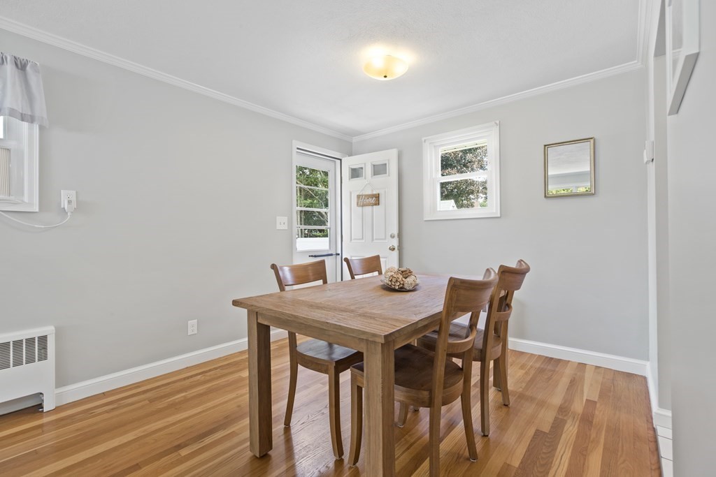 18 Blackman Road Canton, MA 02021 - Photo 7 of 30 a view of a dining room with furniture and wooden floor