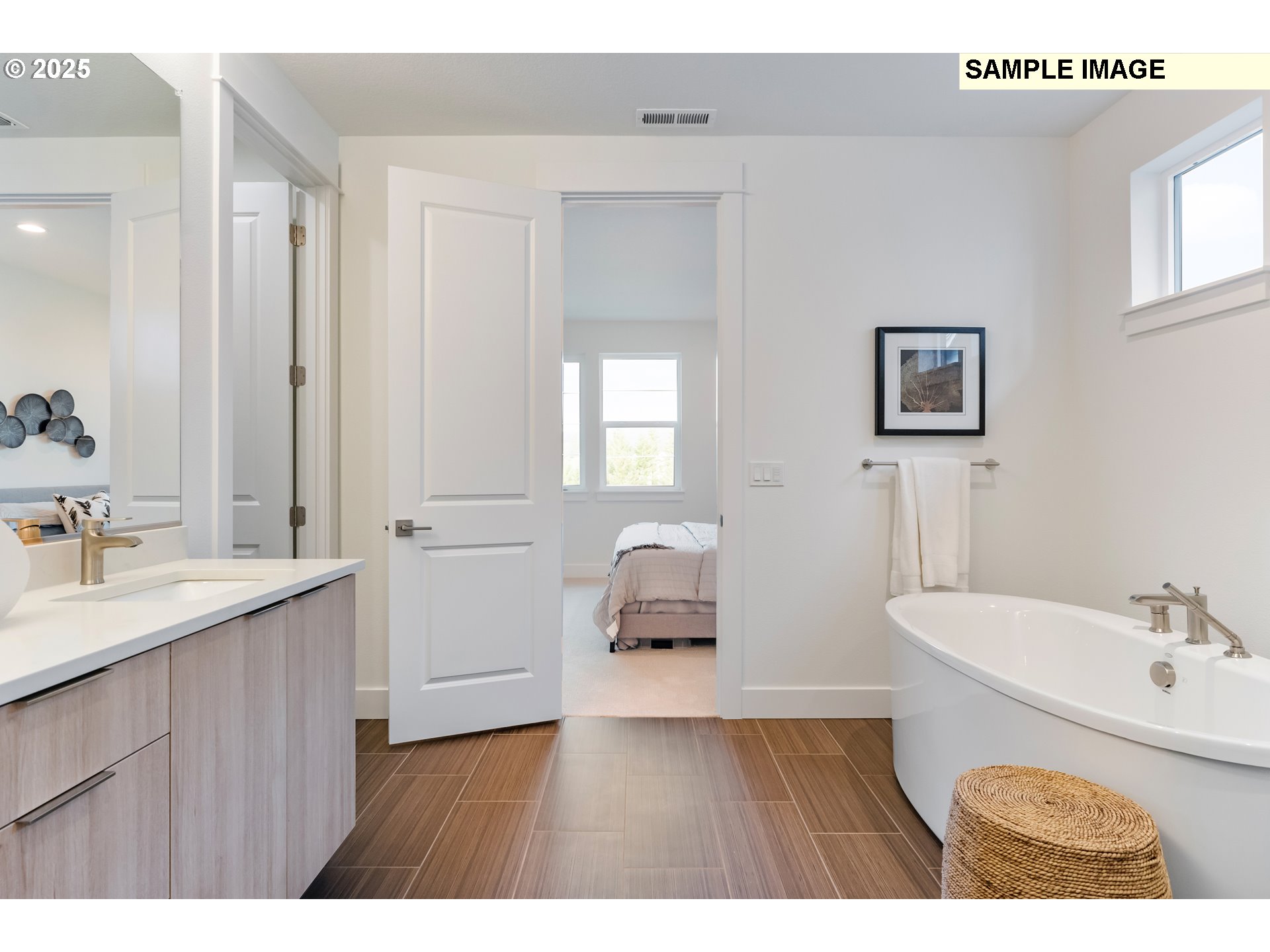16060 Northwest Holman Way, Unit L79 Portland, OR 97229 - Photo 21 of 33 a en suite bathroom with a sink and a mirror