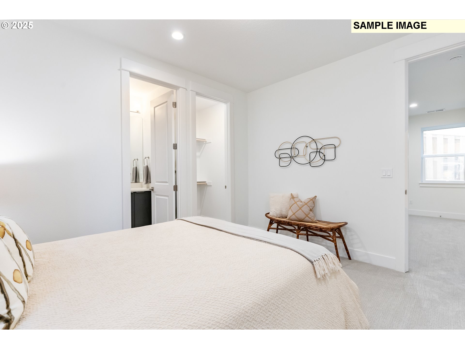 16060 Northwest Holman Way, Unit L79 Portland, OR 97229 - Photo 27 of 33 a bed room with a bed and a painting on the wall