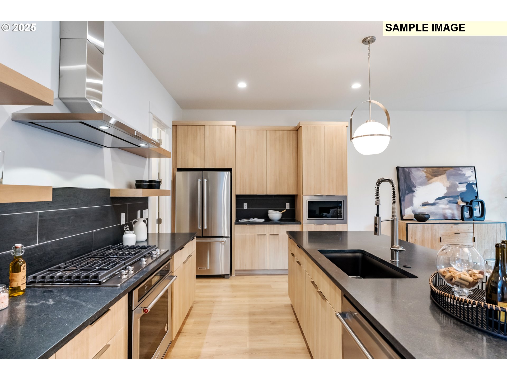16060 Northwest Holman Way, Unit L79 Portland, OR 97229 - Photo 32 of 33 a kitchen with stainless steel appliances granite countertop a sink stove and refrigerator