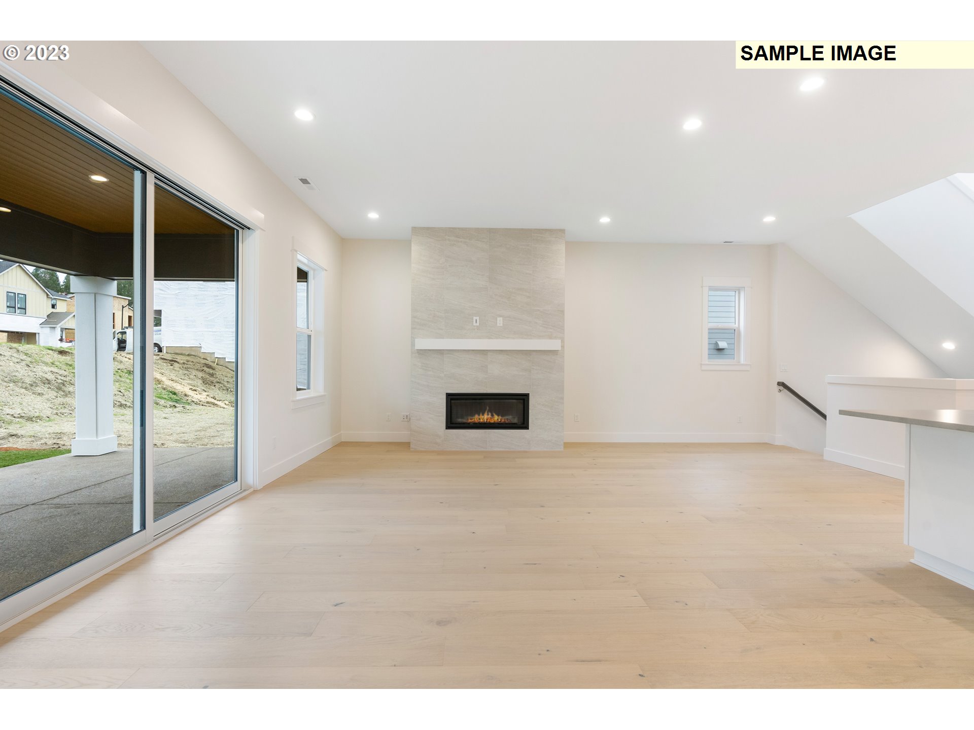 16060 Northwest Holman Way, Unit L79 Portland, OR 97229 - Photo 5 of 33 a view of an empty room with a fireplace