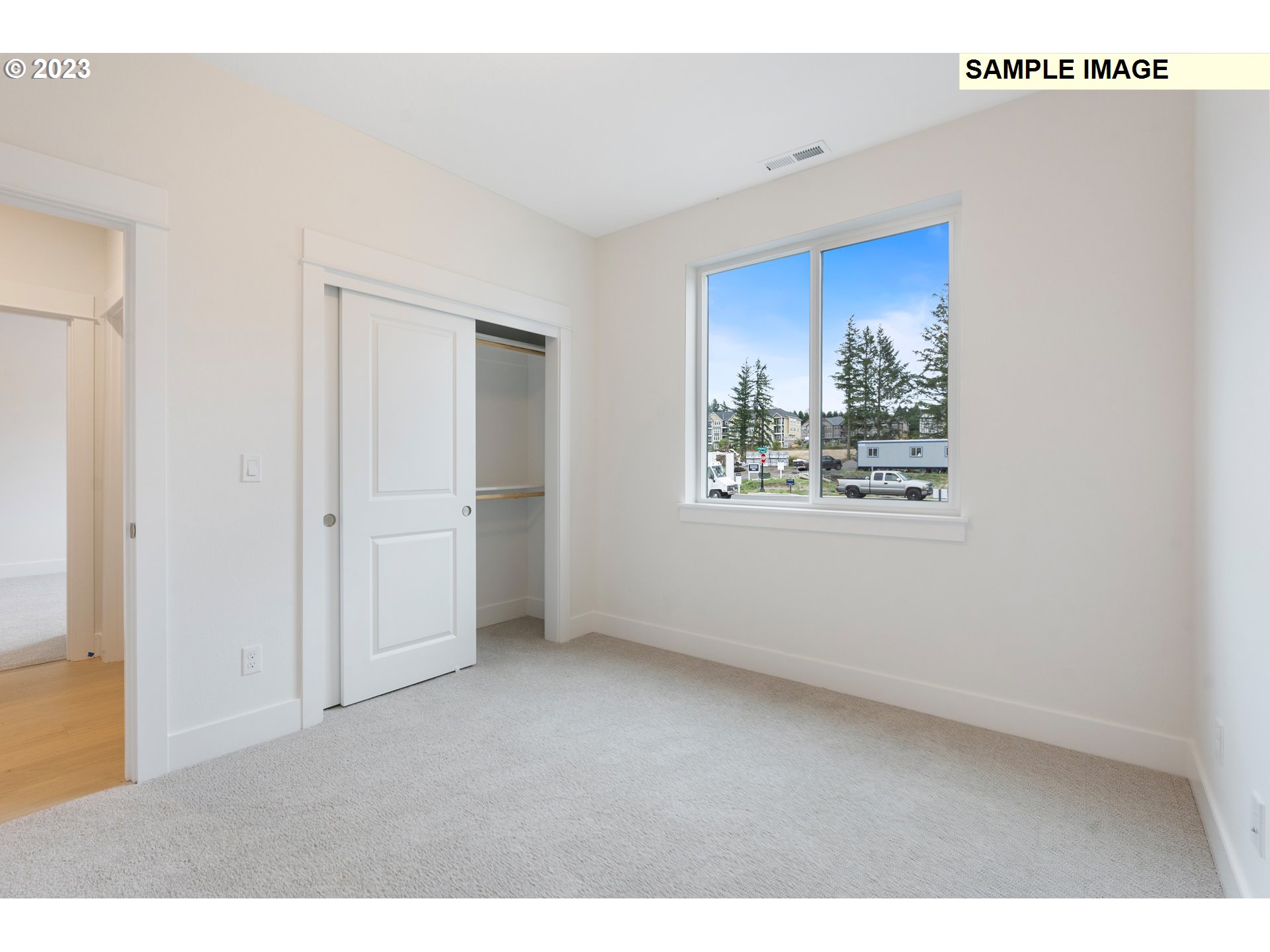 16060 Northwest Holman Way, Unit L79 Portland, OR 97229 - Photo 8 of 33 a view of an empty room with a window