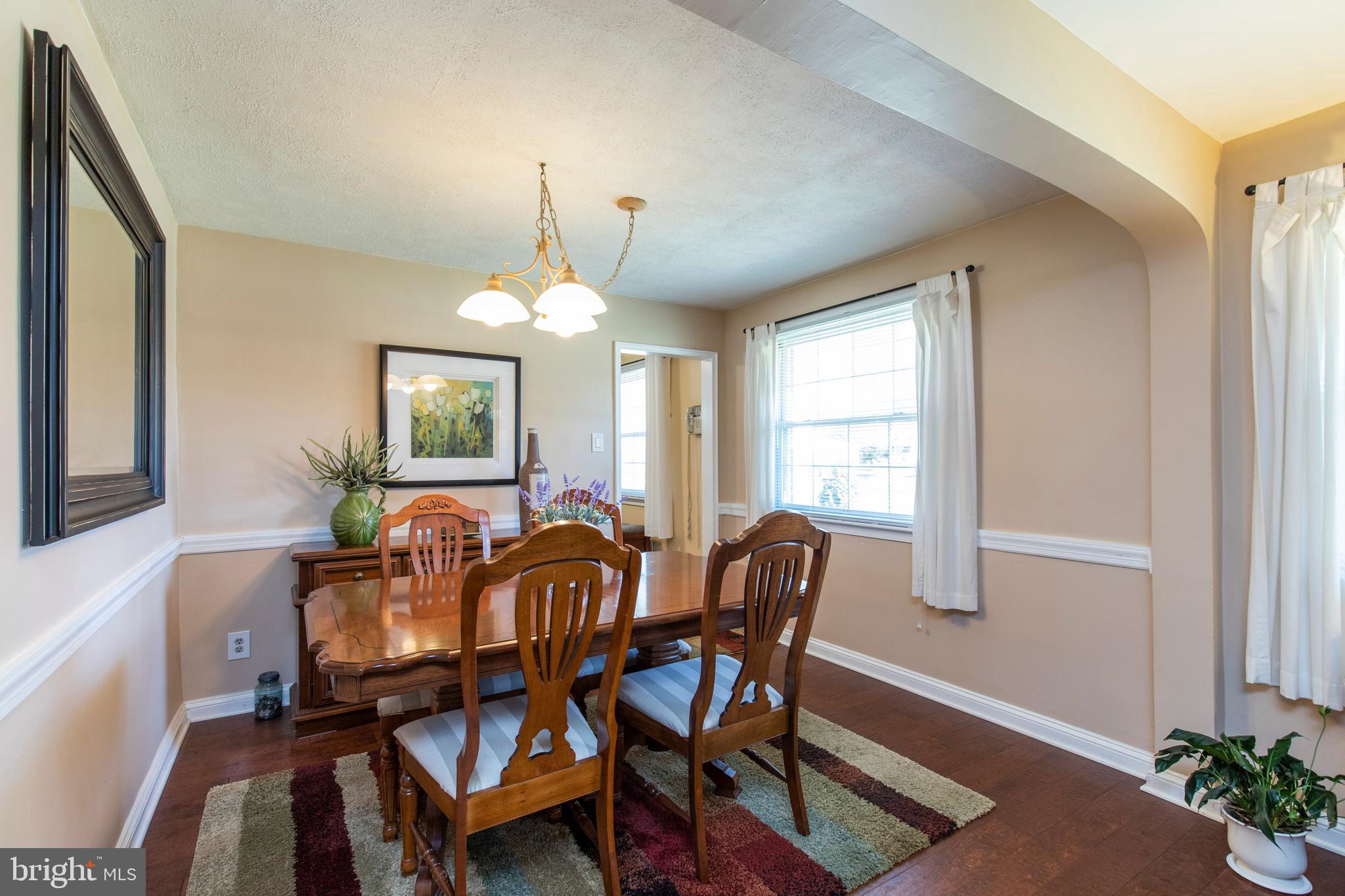514 Maplewood Road Springfield, PA 19064 - Photo 8 of 38 a view of a dining room with furniture and chandelier