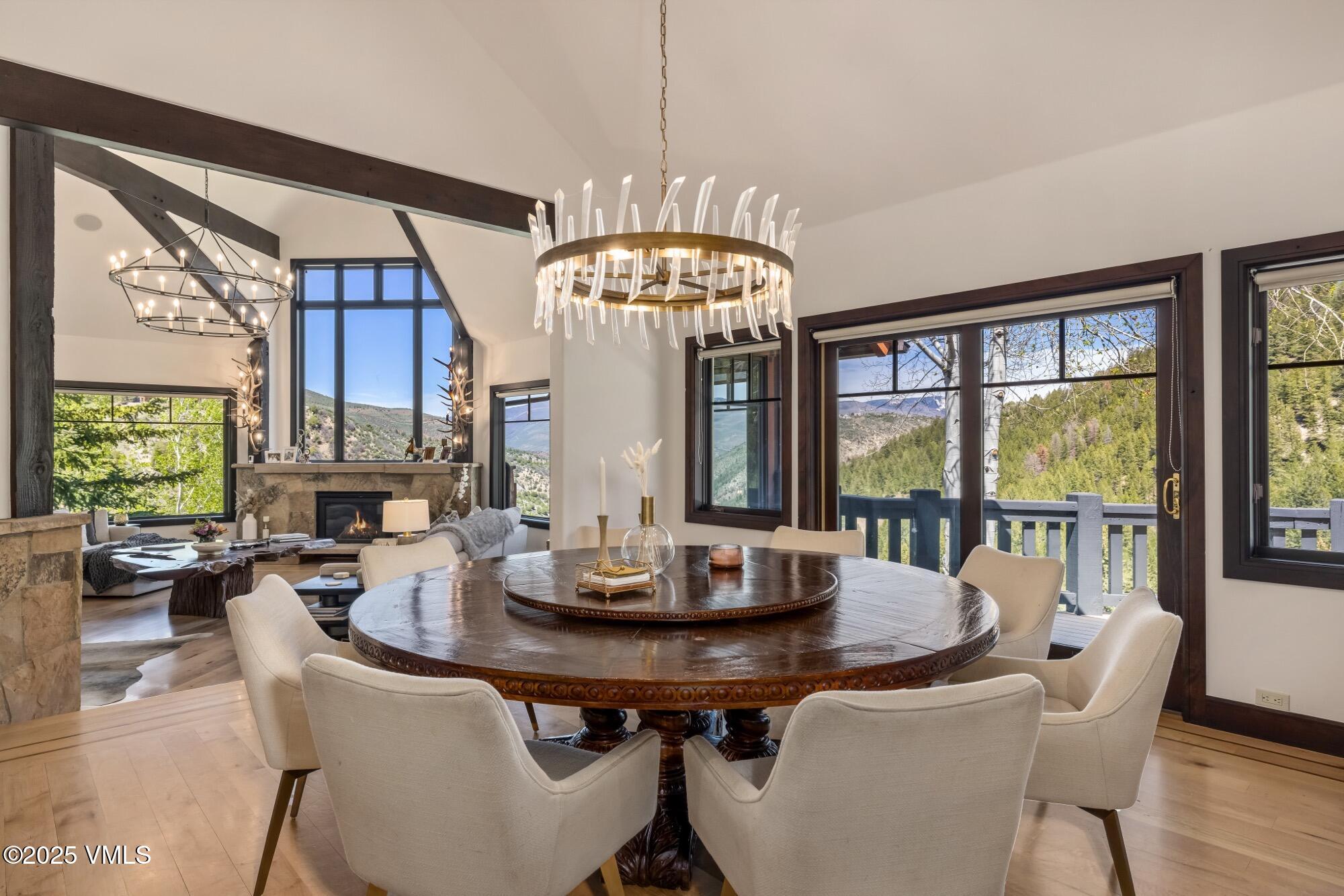 1122 Red Draw Edwards, CO 81632 - Photo 17 of 54 a view of a dining room with furniture a chandelier and large windows