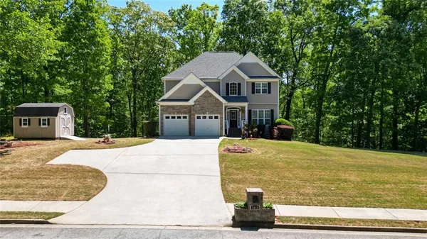 a house with yard in front of it