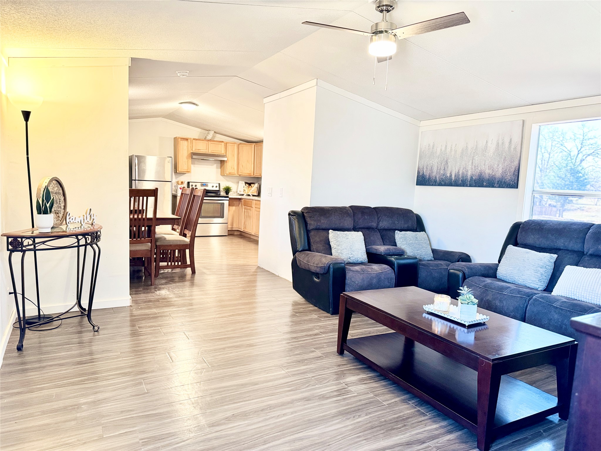 6739 Taylorsville Road Dale, TX 78616 - Photo 17 of 37 a living room with furniture and wooden floor