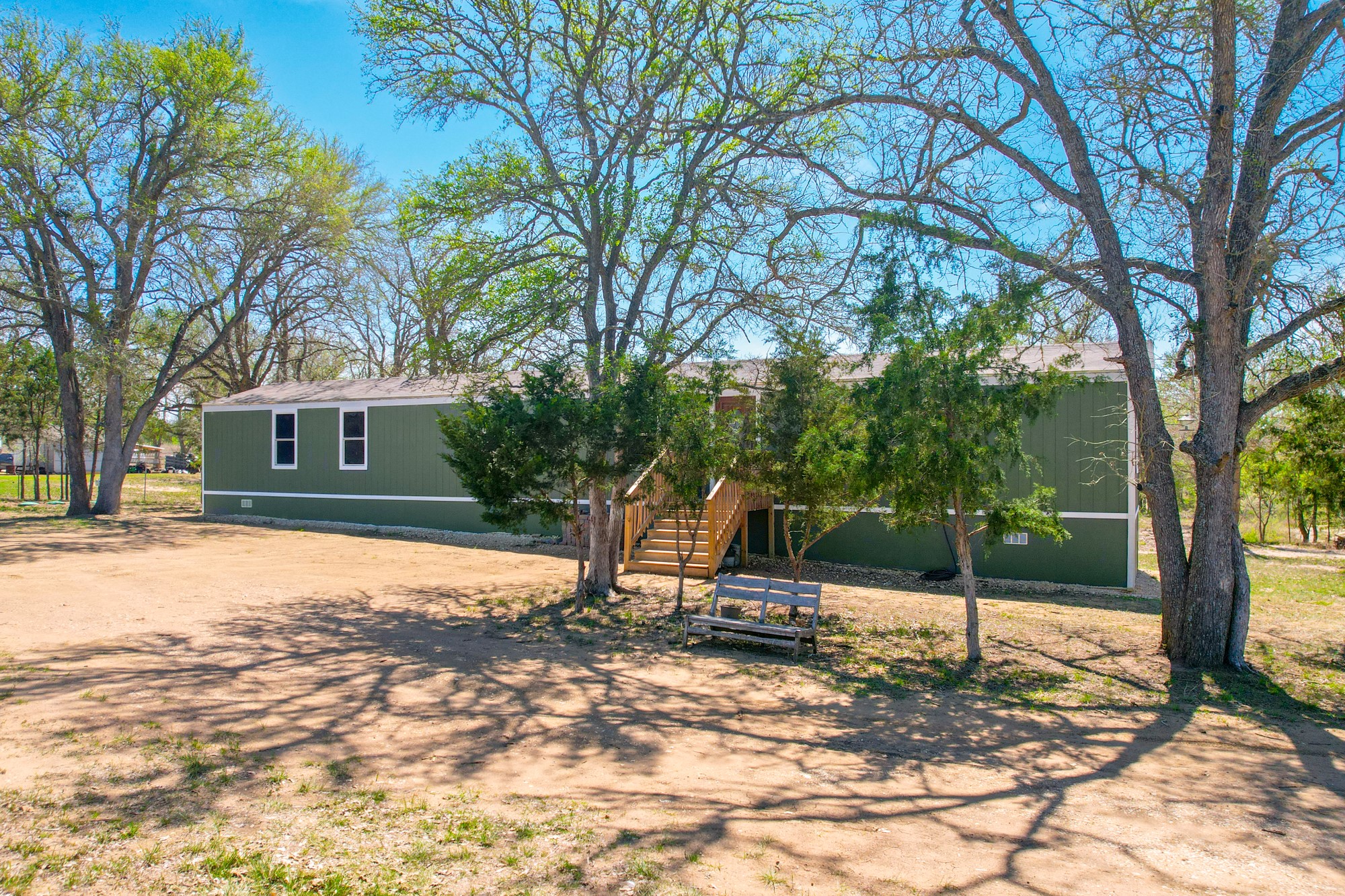 6739 Taylorsville Road Dale, TX 78616 - Photo 2 of 37 a view of a house with a yard covered in snow