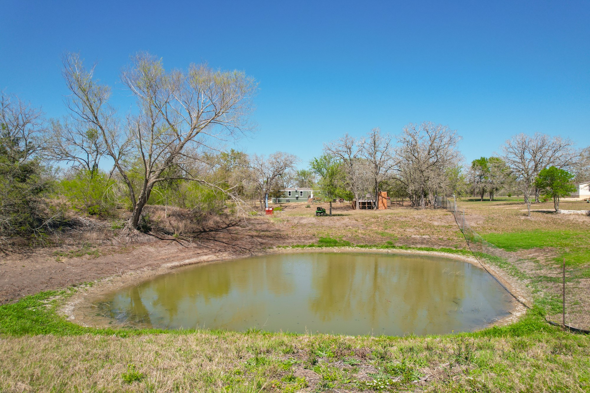 6739 Taylorsville Road Dale, TX 78616 - Photo 27 of 37 a view of a swimming pool and a yard