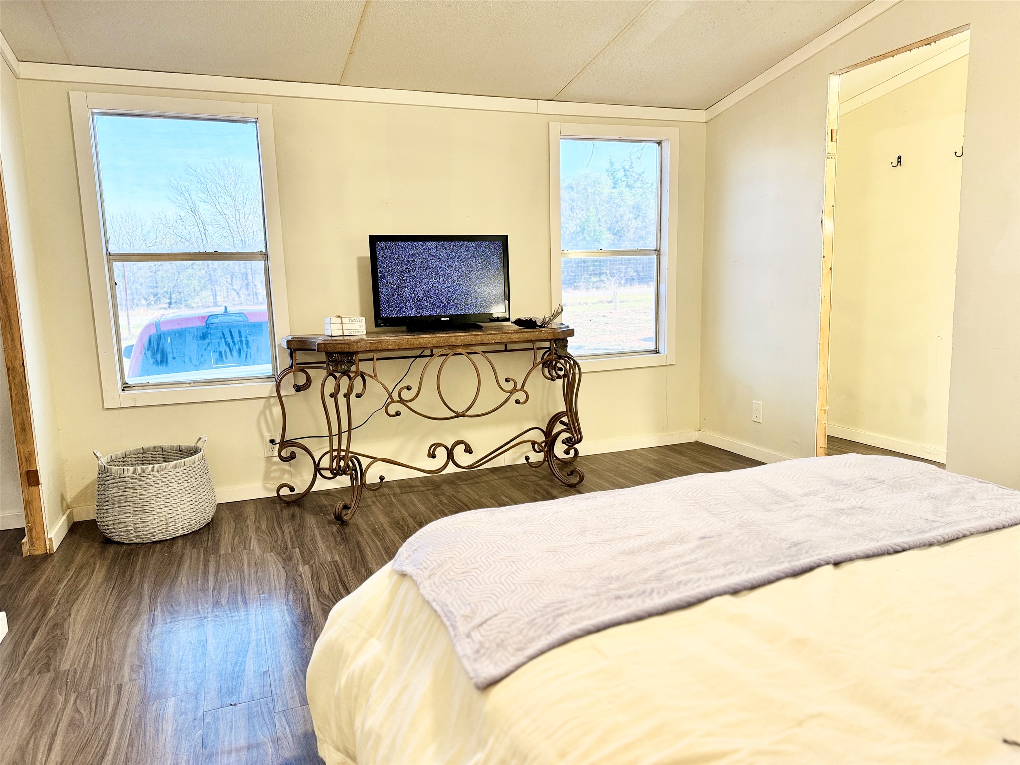 6739 Taylorsville Road Dale, TX 78616 - Photo 7 of 37 a bedroom with a bed and wooden floor